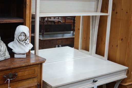 A contemporary Island Furniture Design white painted tall dressing table with part mirrored shelved back, width 105cm, depth 60cm, height 246cm